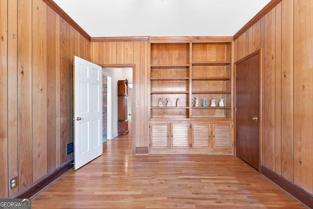 9095 Cedar Grove Rd, Fairburn, GA 30213 - spare room with crown molding, wooden walls, and light wood-style floors