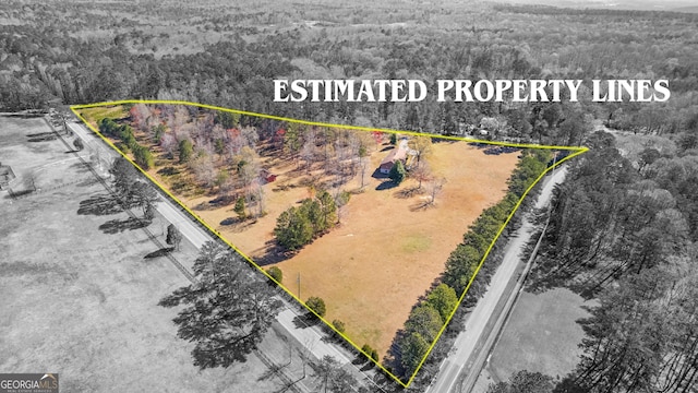 9095 Cedar Grove Rd, Fairburn, GA 30213 - drone / aerial view featuring a forest view