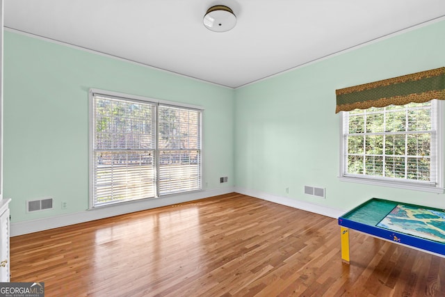 9095 Cedar Grove Rd, Fairburn, GA 30213 - unfurnished room featuring plenty of natural light, visible vents, and wood finished floors