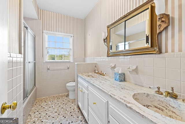9095 Cedar Grove Rd, Fairburn, GA 30213 - full bath featuring wallpapered walls, vanity, toilet, and tile walls