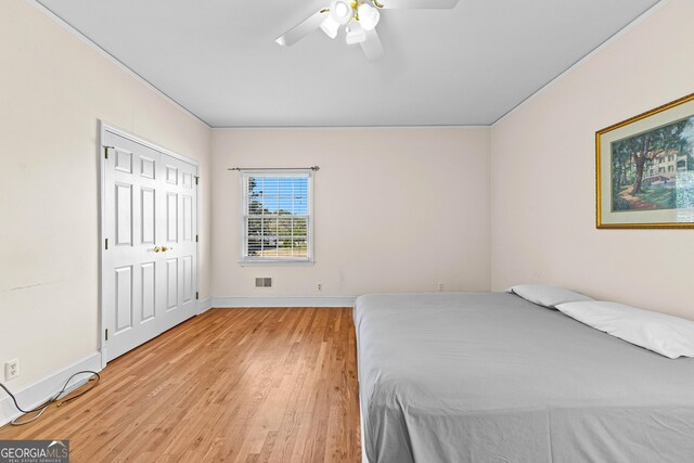 9095 Cedar Grove Rd, Fairburn, GA 30213 - bedroom featuring baseboards, visible vents, a ceiling fan, and light wood finished floors
