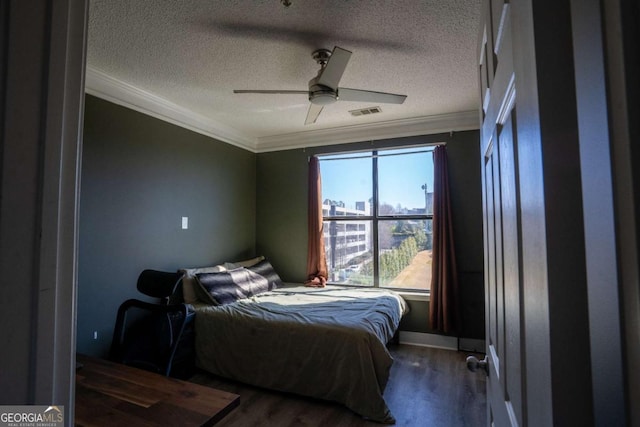 401 16th St NW Unit 1463, Atlanta, GA 30363 - bedroom with visible vents, wood finished floors, ornamental molding, and a textured ceiling