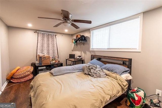 bedroom featuring baseboards, wood finished floors, recessed lighting, and a ceiling fan