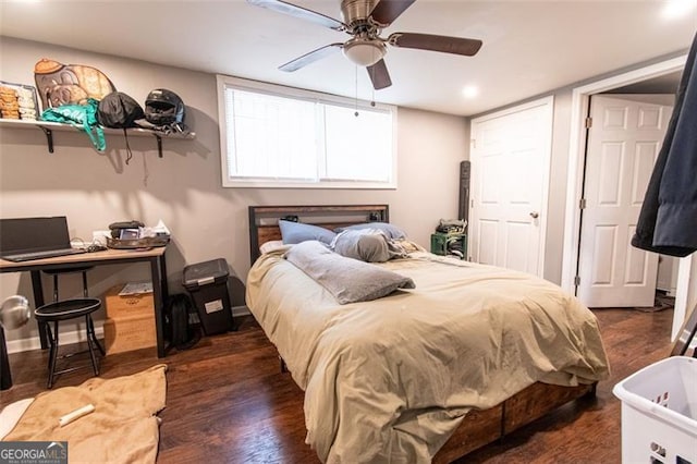 bedroom with dark wood finished floors, baseboards, and a ceiling fan