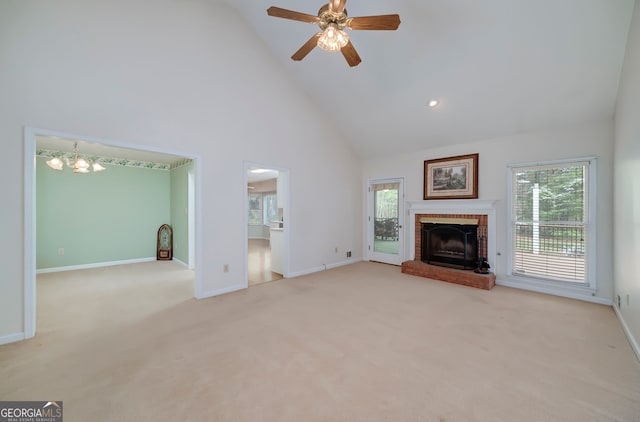 195 Creekside Way, Mcdonough, GA 30252 - unfurnished living room with high vaulted ceiling, healthy amount of natural light, a fireplace, carpet floors, and baseboards