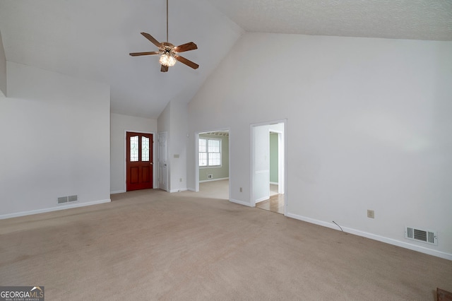 195 Creekside Way, Mcdonough, GA 30252 - unfurnished living room featuring high vaulted ceiling, a ceiling fan, baseboards, and carpet floors