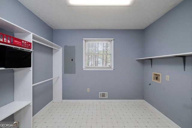 195 Creekside Way, Mcdonough, GA 30252 - washroom with electric panel, tile patterned floors, washer hookup, baseboards, and a textured ceiling