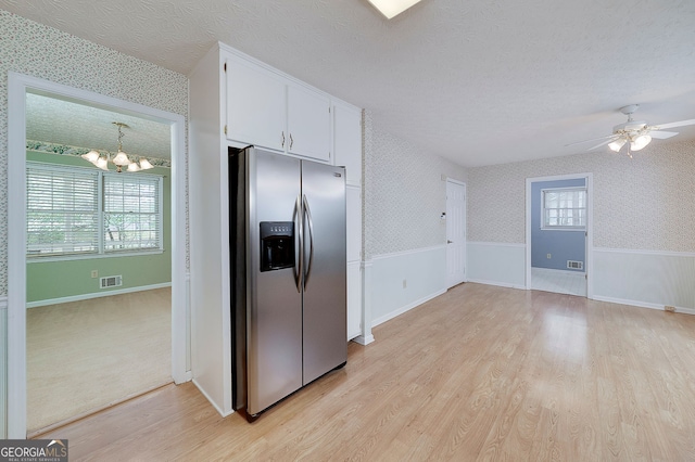 195 Creekside Way, Mcdonough, GA 30252 - kitchen with stainless steel refrigerator with ice dispenser, light wood finished floors, a chandelier, wallpapered walls, and white cabinetry