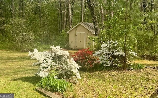 195 Creekside Way, Mcdonough, GA 30252 - view of shed with a forest view