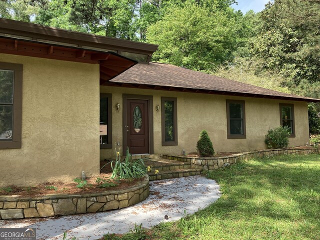 1288 Lakewood Dr NE, Conyers, GA 30013 - view of front of house featuring a front yard