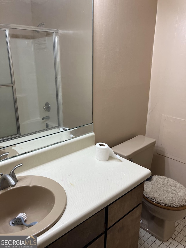 full bath with vanity, tile patterned floors, and toilet