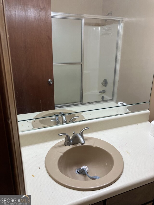1288 Lakewood Dr NE, Conyers, GA 30013 - full bathroom featuring enclosed tub / shower combo and vanity