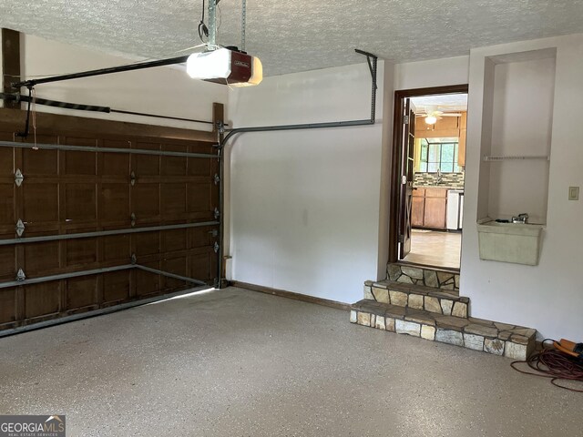 1288 Lakewood Dr NE, Conyers, GA 30013 - garage with a sink and a garage door opener
