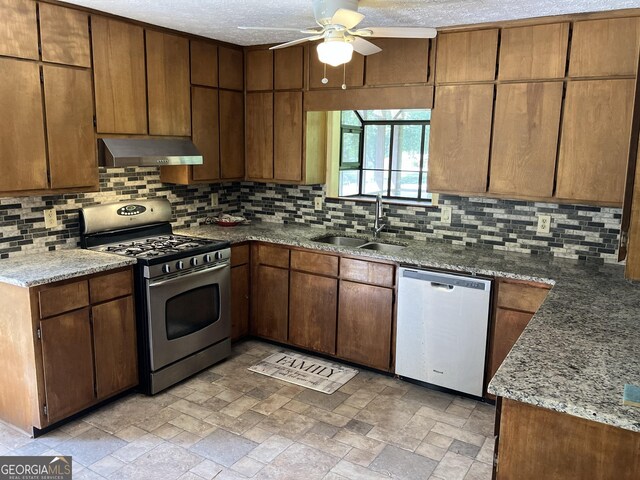 1288 Lakewood Dr NE, Conyers, GA 30013 - kitchen with a ceiling fan, backsplash, appliances with stainless steel finishes, a sink, and under cabinet range hood