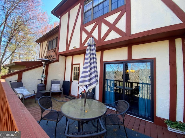 wooden deck with outdoor dining space