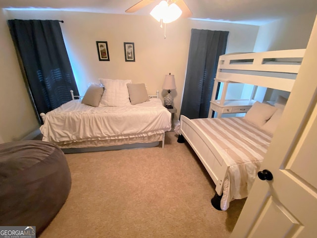 carpeted bedroom featuring a ceiling fan