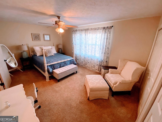 bedroom featuring a ceiling fan and carpet