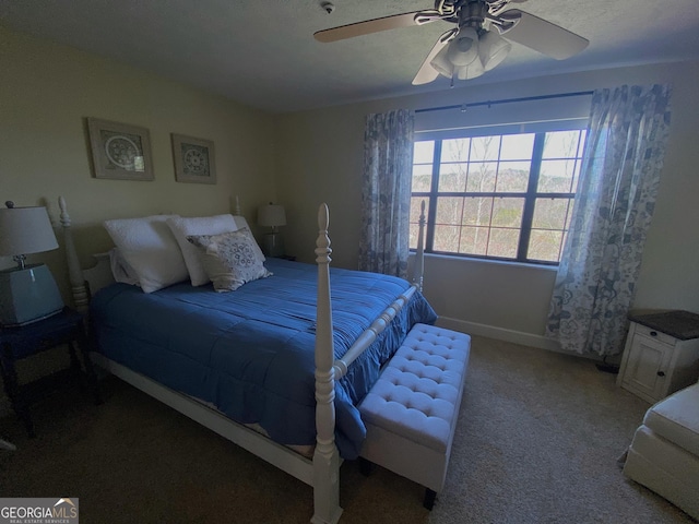 carpeted bedroom with baseboards and ceiling fan