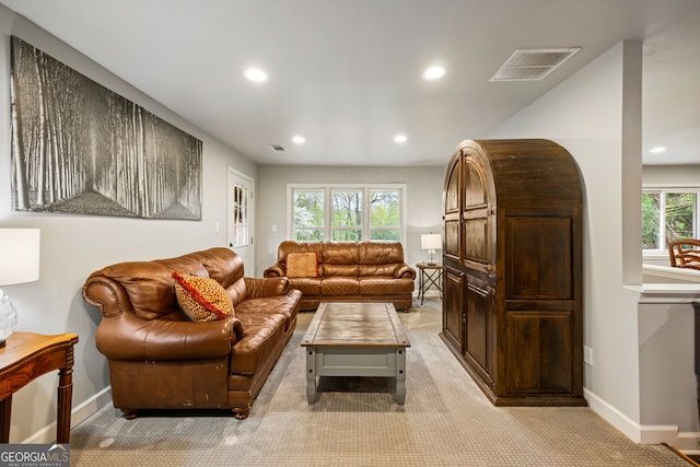 living room with baseboards, visible vents, recessed lighting, and light colored carpet