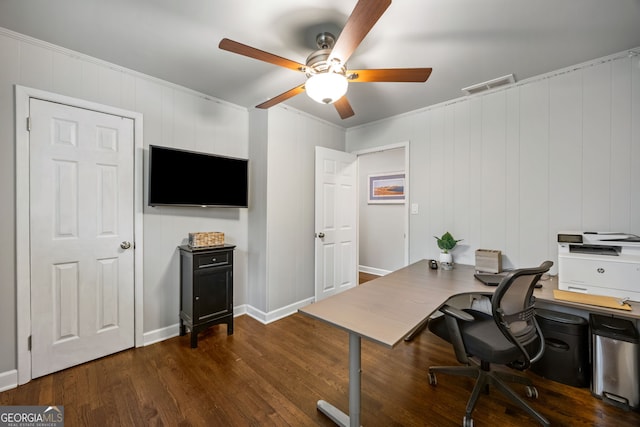 office area featuring baseboards, visible vents, dark wood-type flooring, and a ceiling fan