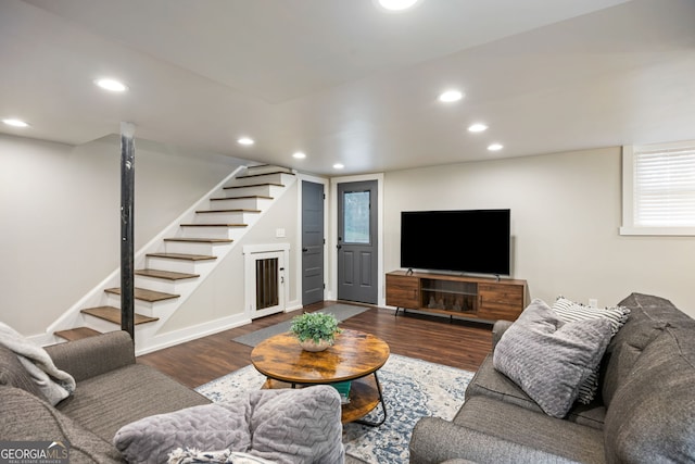 living area featuring stairs, wood finished floors, baseboards, and recessed lighting