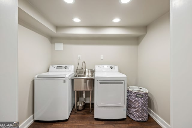 washroom with laundry area, recessed lighting, dark wood finished floors, a sink, and separate washer and dryer