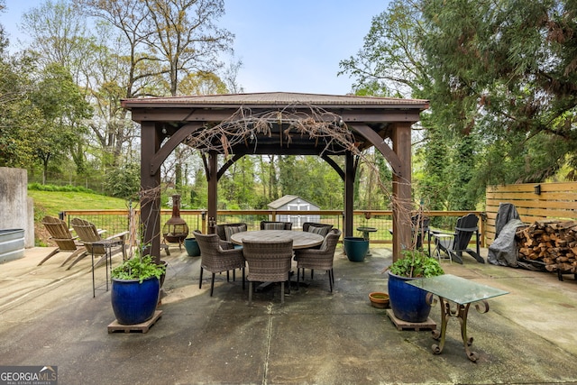 view of patio / terrace featuring outdoor dining space and a gazebo