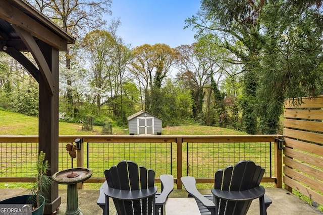 exterior space with an outbuilding, a storage unit, and an outdoor fire pit
