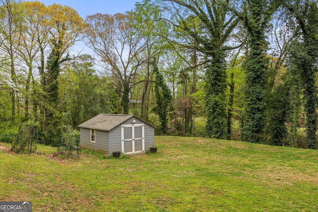 view of yard with an outbuilding and a storage shed