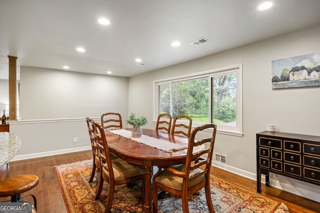 dining room featuring baseboards, visible vents, recessed lighting, and wood finished floors