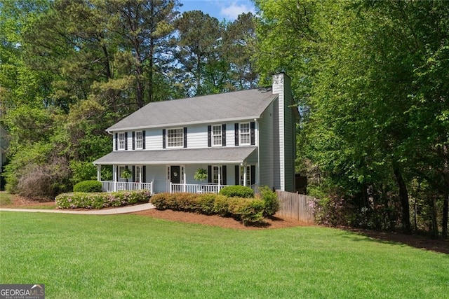 2731 Old Coach Rd, Duluth, GA 30096 - view of front of home featuring a chimney and covered porch