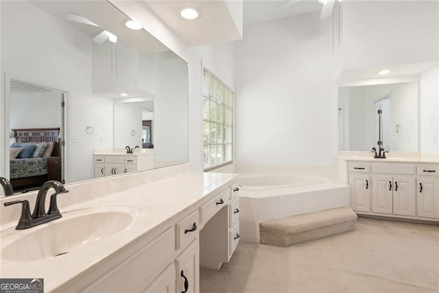2731 Old Coach Rd, Duluth, GA 30096 - full bathroom featuring two vanities, ensuite bath, a bath, and recessed lighting