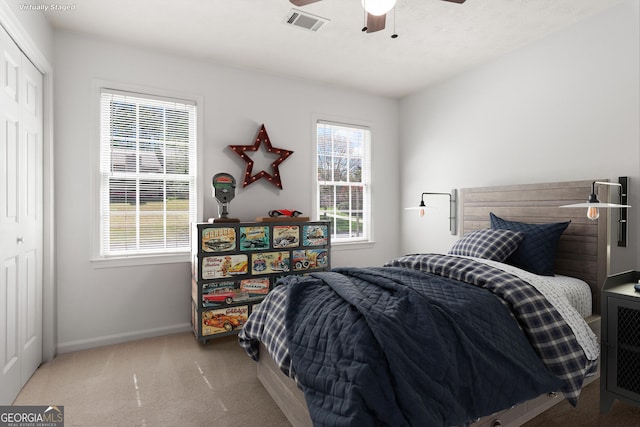 2731 Old Coach Rd, Duluth, GA 30096 - carpeted bedroom with multiple windows, a closet, and a ceiling fan