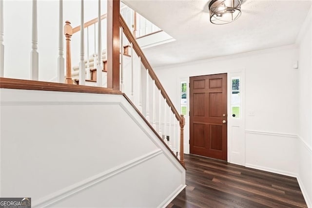 2731 Old Coach Rd, Duluth, GA 30096 - foyer entrance featuring stairs, dark wood-style floors, and ornamental molding
