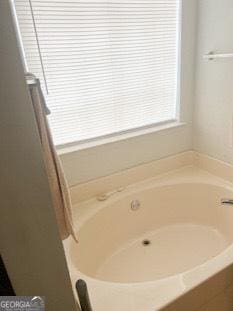 full bath with a garden tub