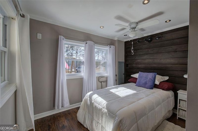 bedroom featuring wood finished floors, crown molding, baseboards, recessed lighting, and a ceiling fan