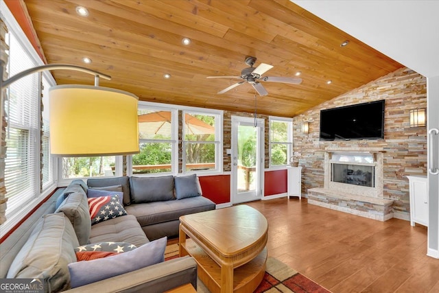 living room with wood ceiling, vaulted ceiling, healthy amount of natural light, ceiling fan, and wood finished floors