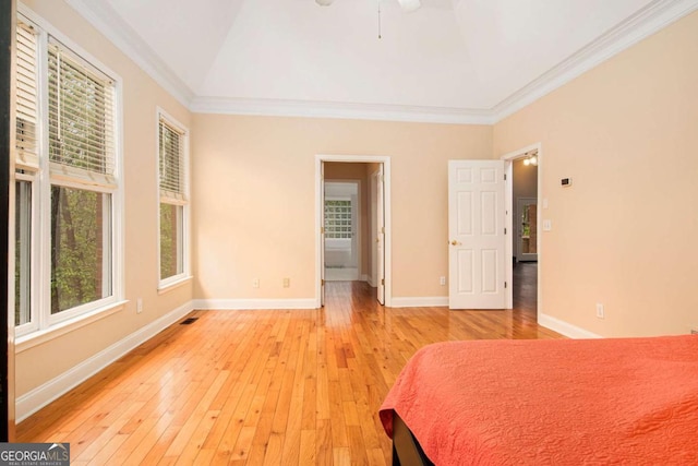 4236 Providence Ln, Tucker, GA 30084 - unfurnished bedroom featuring vaulted ceiling, ornamental molding, baseboards, and light wood finished floors