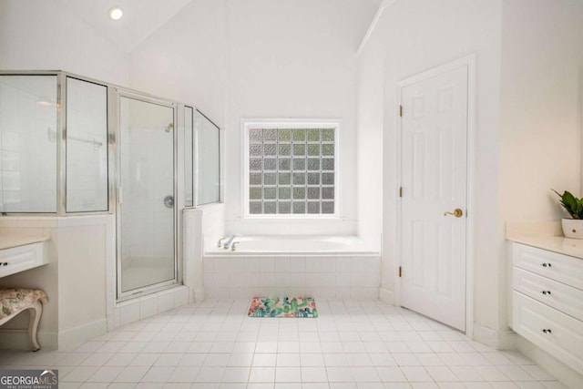 4236 Providence Ln, Tucker, GA 30084 - bathroom with a stall shower, tile patterned floors, lofted ceiling, and a garden tub