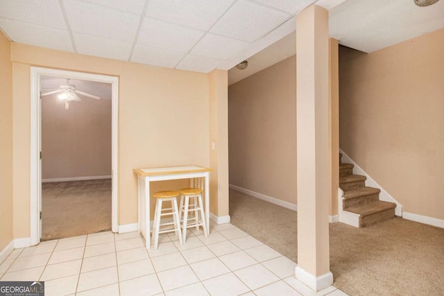 4236 Providence Ln, Tucker, GA 30084 - finished below grade area with a drop ceiling, light tile patterned floors, and light colored carpet