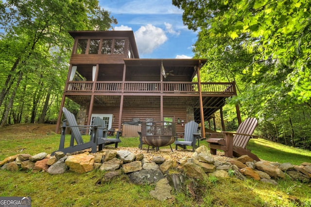 54 Channing Holw, Morganton, GA 30560 - back of house featuring a fire pit, a deck, and faux log siding