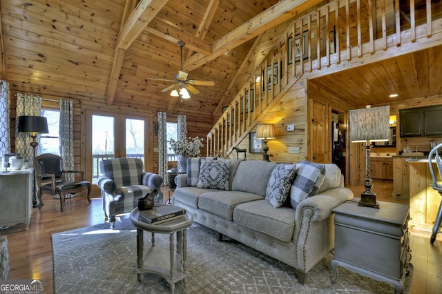 54 Channing Holw, Morganton, GA 30560 - living room featuring wood ceiling with exposed beams, stairs, wood finished floors, ceiling fan, and wooden walls