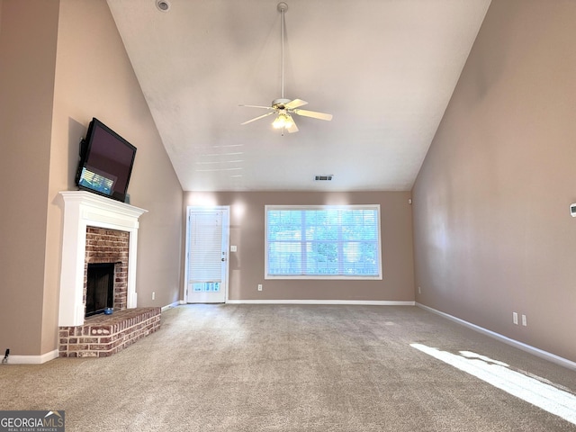 unfurnished living room featuring carpet floors, ceiling fan, a fireplace, baseboards, and high vaulted ceiling
