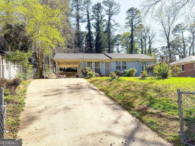 2985 Catalina Dr, Decatur, GA 30032 - ranch-style home featuring an attached carport, fence, and concrete driveway