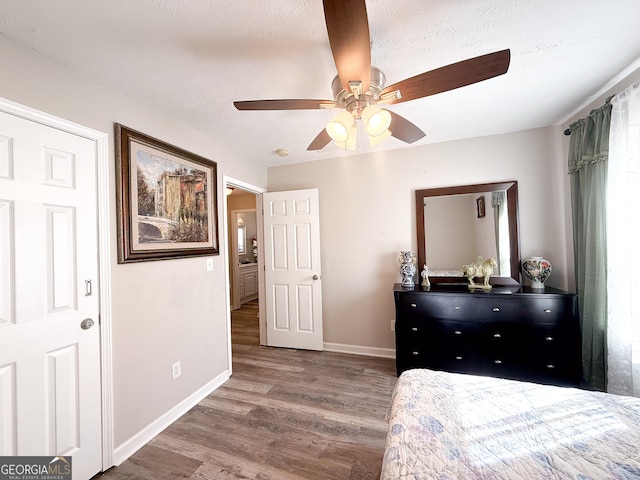 2985 Catalina Dr, Decatur, GA 30032 - bedroom featuring a textured ceiling, baseboards, ceiling fan, and wood finished floors