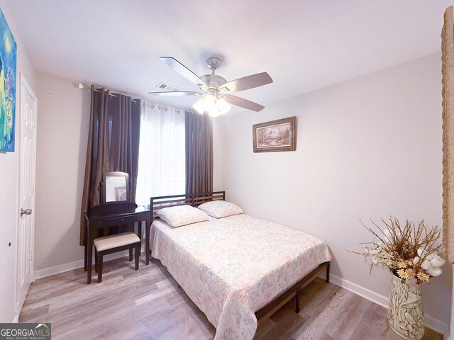 2985 Catalina Dr, Decatur, GA 30032 - bedroom with light wood-style flooring, baseboards, and ceiling fan