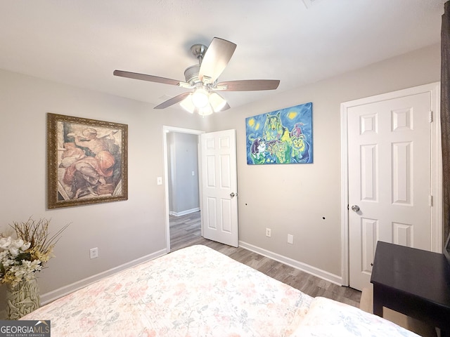 2985 Catalina Dr, Decatur, GA 30032 - unfurnished bedroom featuring baseboards, wood finished floors, and a ceiling fan
