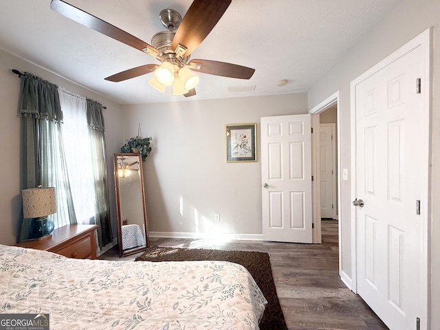 2985 Catalina Dr, Decatur, GA 30032 - bedroom featuring baseboards, a textured ceiling, visible vents, ceiling fan, and wood finished floors