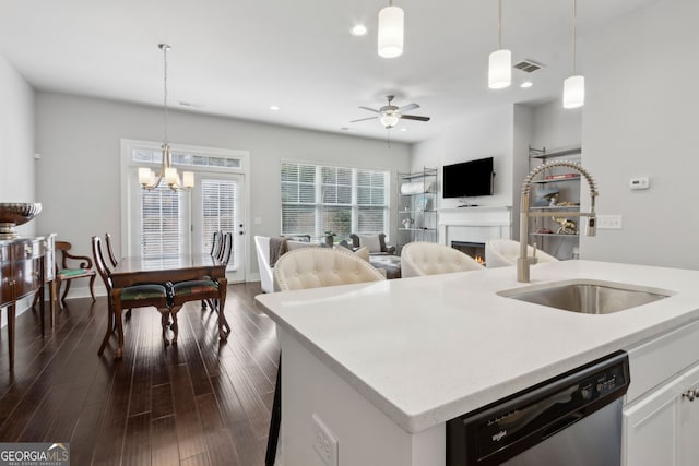 5726 Taylor Way, Sandy Springs, GA 30342 - kitchen featuring dishwasher, open floor plan, a ceiling fan, white cabinets, and hanging light fixtures