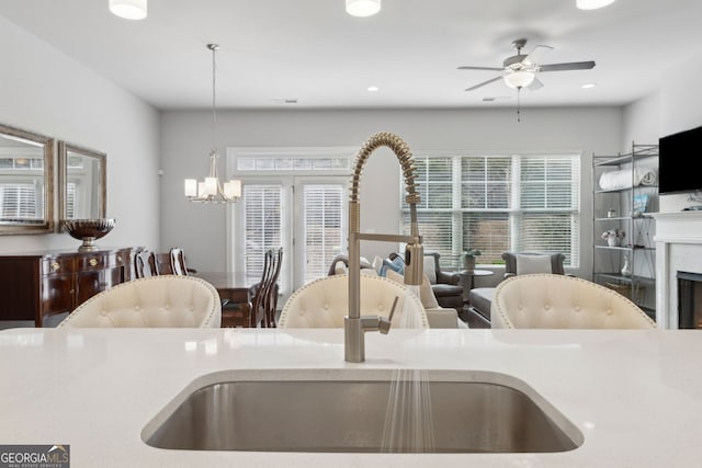 5726 Taylor Way, Sandy Springs, GA 30342 - kitchen with a ceiling fan, a chandelier, healthy amount of natural light, hanging light fixtures, and recessed lighting